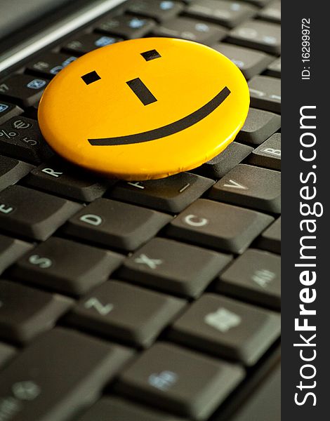 Smile emoticon on the laptop keyboard