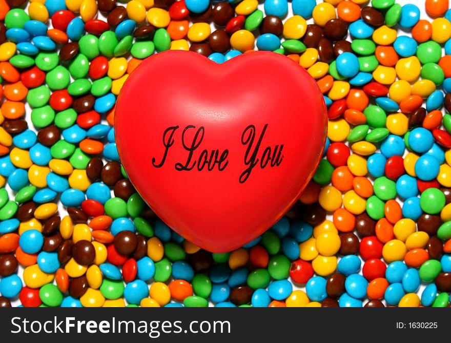 Soft Red Heart Over Candy Background