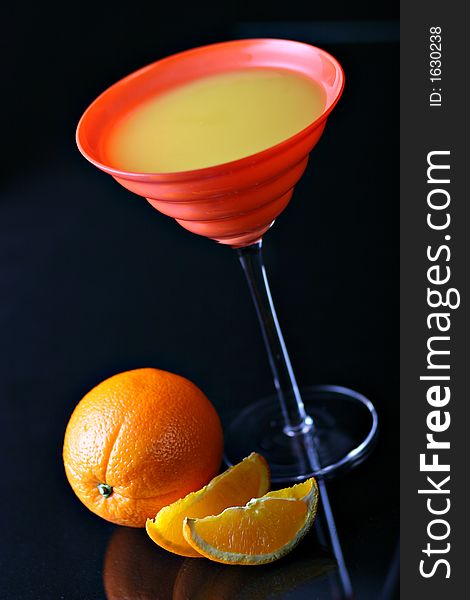 Fresh orange juice in red glass