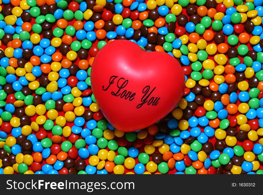 Soft Red Heart Over Candy Background