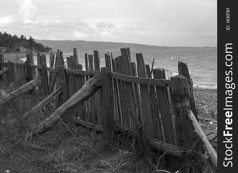 Leaning fence propped up on the west coast shore. Leaning fence propped up on the west coast shore