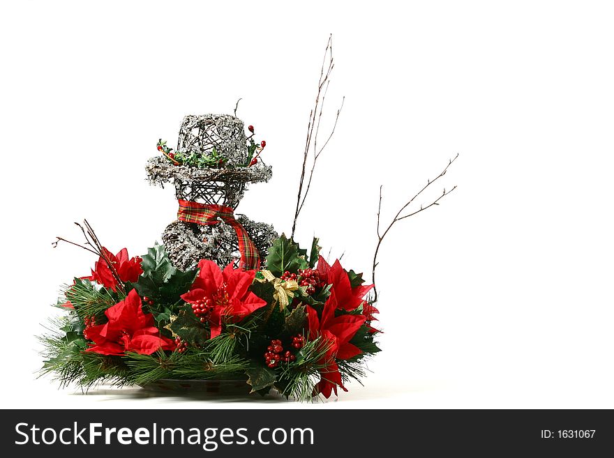 Snowman Christmas basket with greenery, berries, holly, and wrapped presents isolated on white space