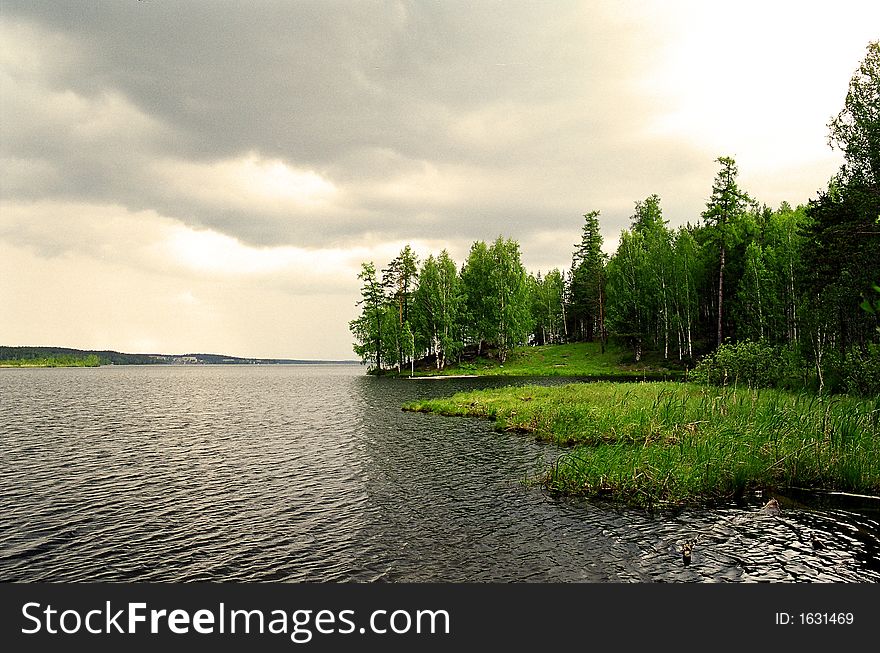 View of lake Tavatuy in Russia before thunderstorm