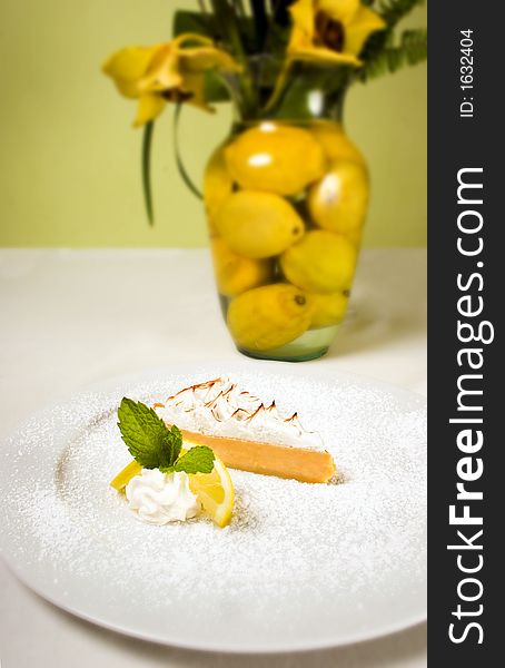 A lemon pie on top of a table. A lemon pie on top of a table.