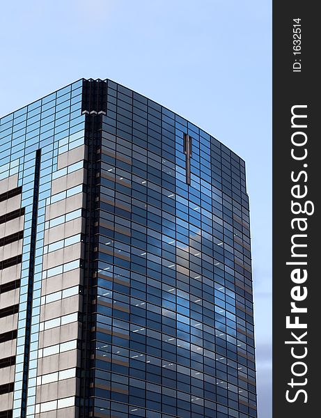 Image of an offices building with lights inside in the evening. Image of an offices building with lights inside in the evening.