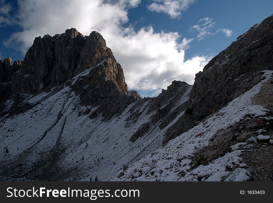 Mountain trails with snowy slopes in the Cadiny group in Dolomiti mountains in Italy