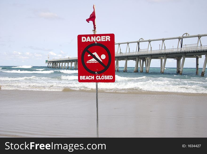 Beach closed because of a rip in the ocean. close shot with the pier. Beach closed because of a rip in the ocean. close shot with the pier