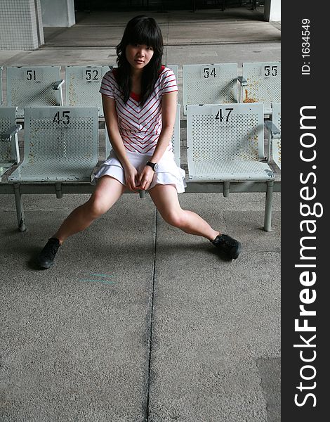 Girl sitting on a bench. Girl sitting on a bench