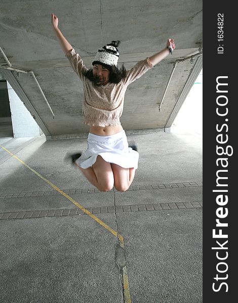 Girl jumping with legs up