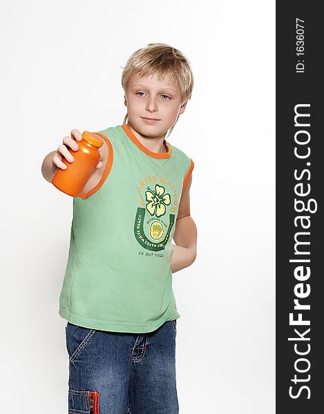 A boy holds in hands  packing with vitamins.