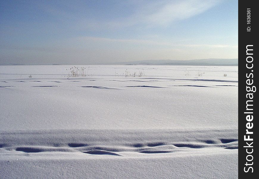 Winter. View of snow field in Russia. Winter. View of snow field in Russia.