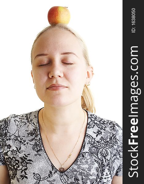Girl meditating apple over her head. Girl meditating apple over her head