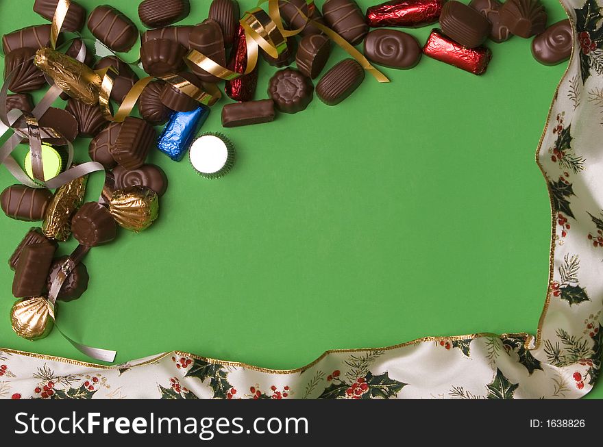 Fine chocolate on green background , christmas ribbon. Fine chocolate on green background , christmas ribbon