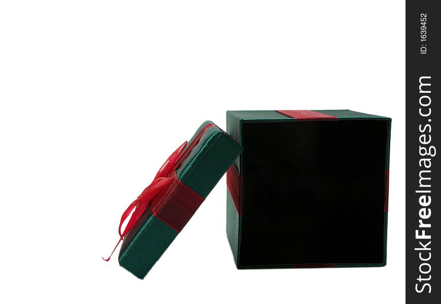 Photo of a green christmas present with a red bow isolated on a white background. Photo of a green christmas present with a red bow isolated on a white background