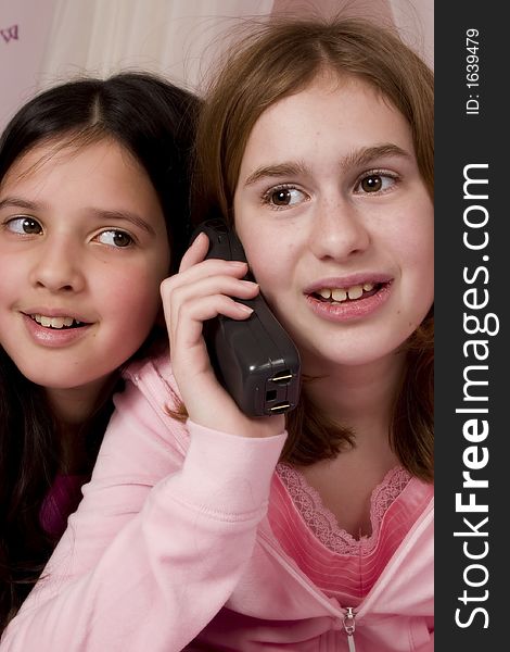 Adorable girls talking on the phone. Adorable girls talking on the phone.