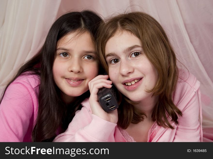 Adorable girls talking on the phone. Adorable girls talking on the phone.