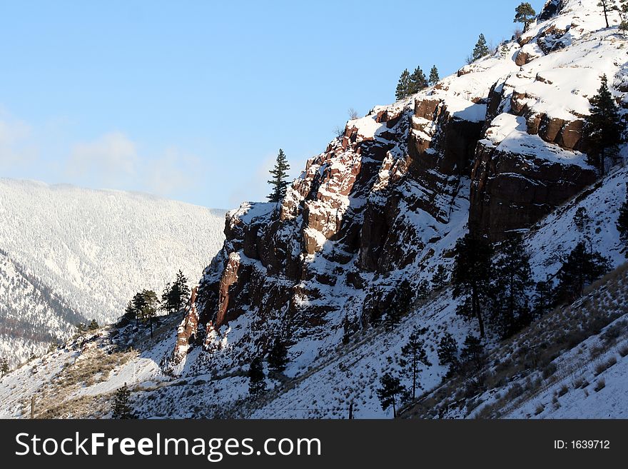 A mountainous snowy winter landscape. A mountainous snowy winter landscape