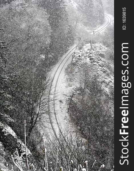 Rail road tracks in the snow from above. Rail road tracks in the snow from above