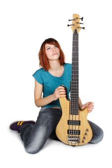Redhead Girl Sitting And Holding Bass Guitar Royalty Free Stock Image