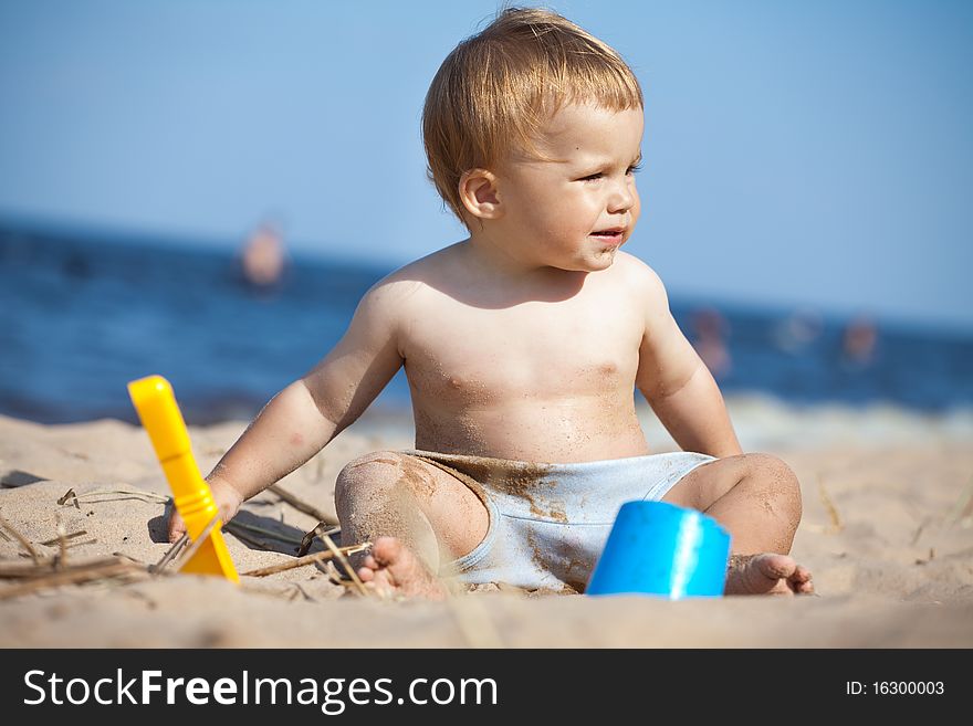 Child playing on a beach. Child playing on a beach