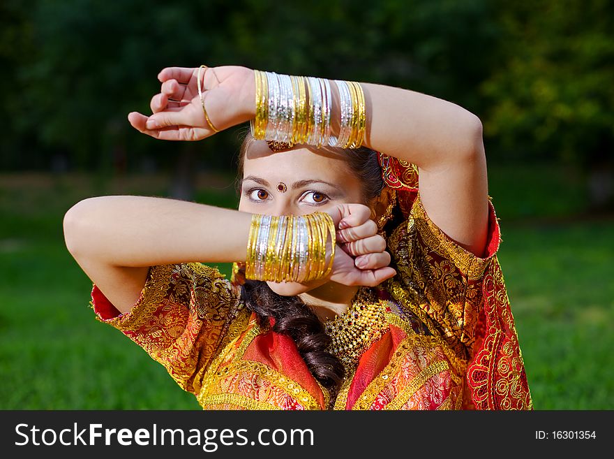 A young Indian woman hiding face