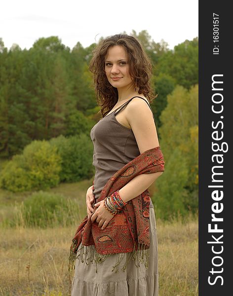 Girl walking in the autumn field. Girl walking in the autumn field