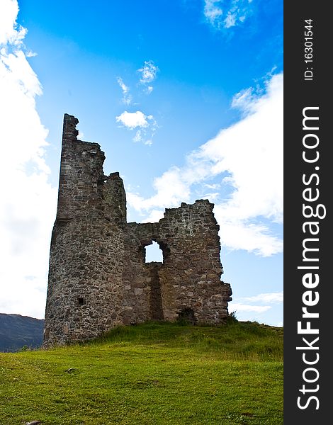 Scotland, Sutherland. Ruiner of a castle on blue sky. Scotland, Sutherland. Ruiner of a castle on blue sky.