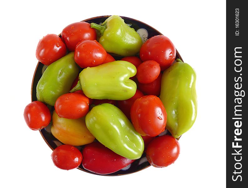 Assorted vegetables. Tomatoes and peppers on a plate