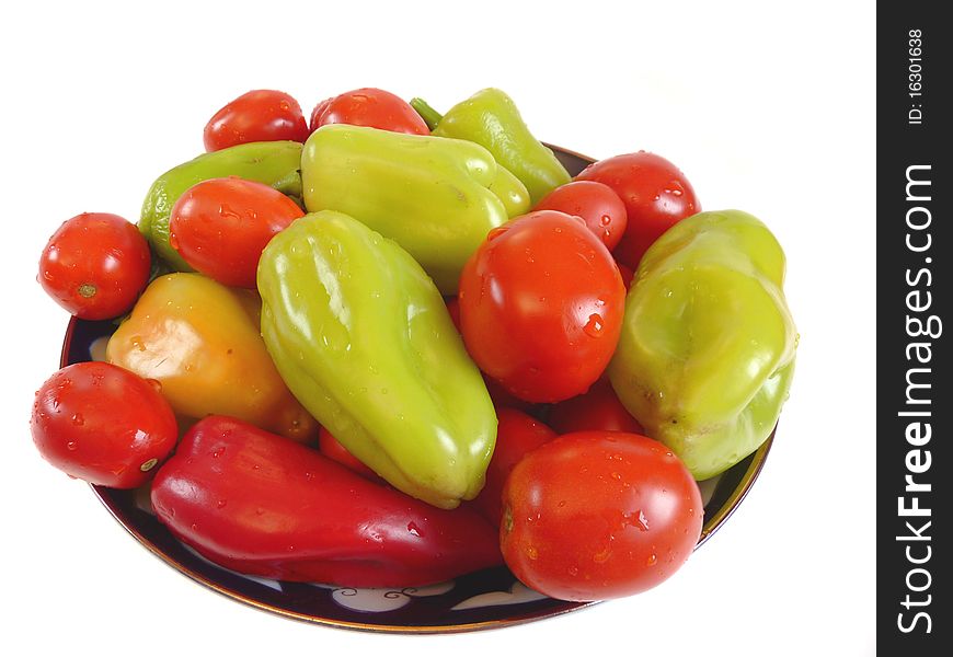 Assorted vegetables. Tomatoes and peppers on a plate