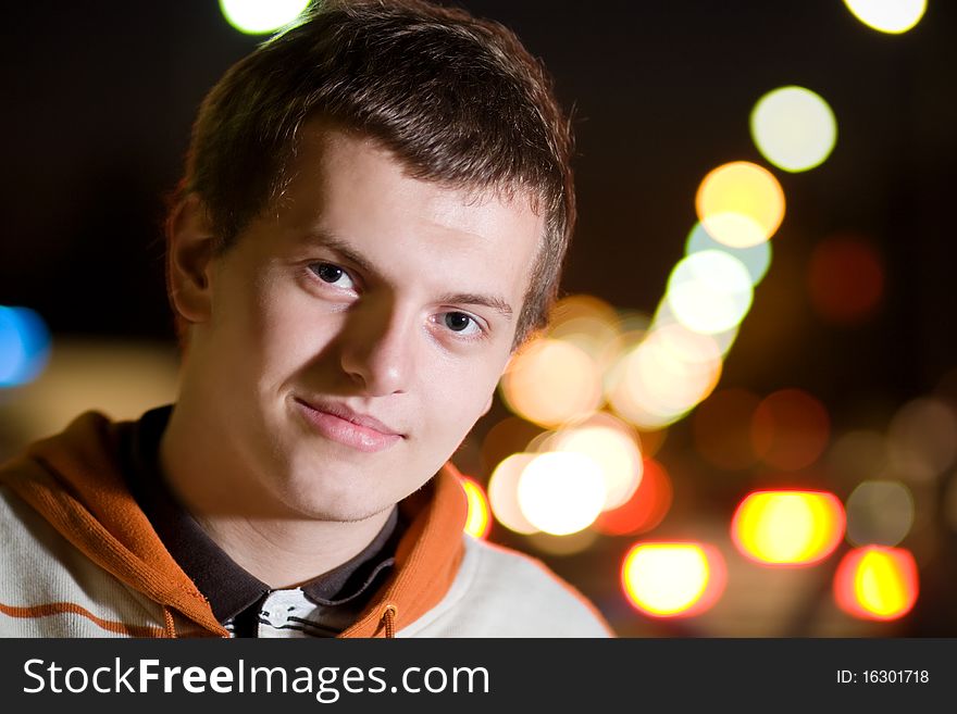 Portrait of teenager boy at night