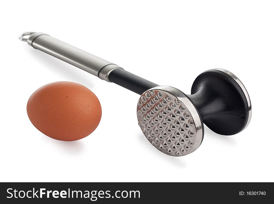 Stainless steel meat mallet wth brown egg, isolated on white