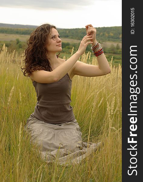 Girl praying in the autumn field. Girl praying in the autumn field