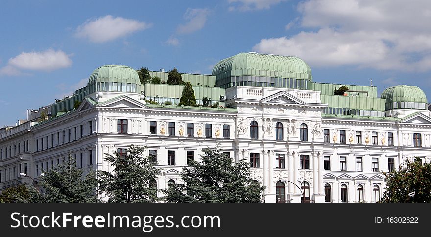 White home building with roof terraces with trees in Vienna. . White home building with roof terraces with trees in Vienna.