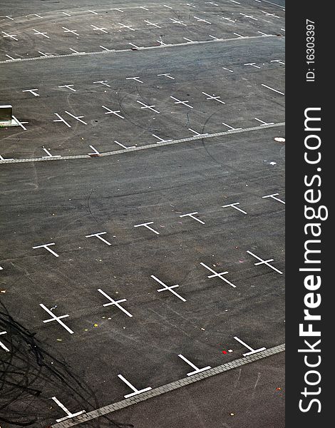 Marked parking lot without cars with crosses