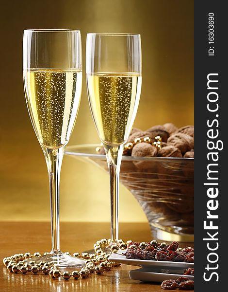 Glasses Of Champagne With Gold Background