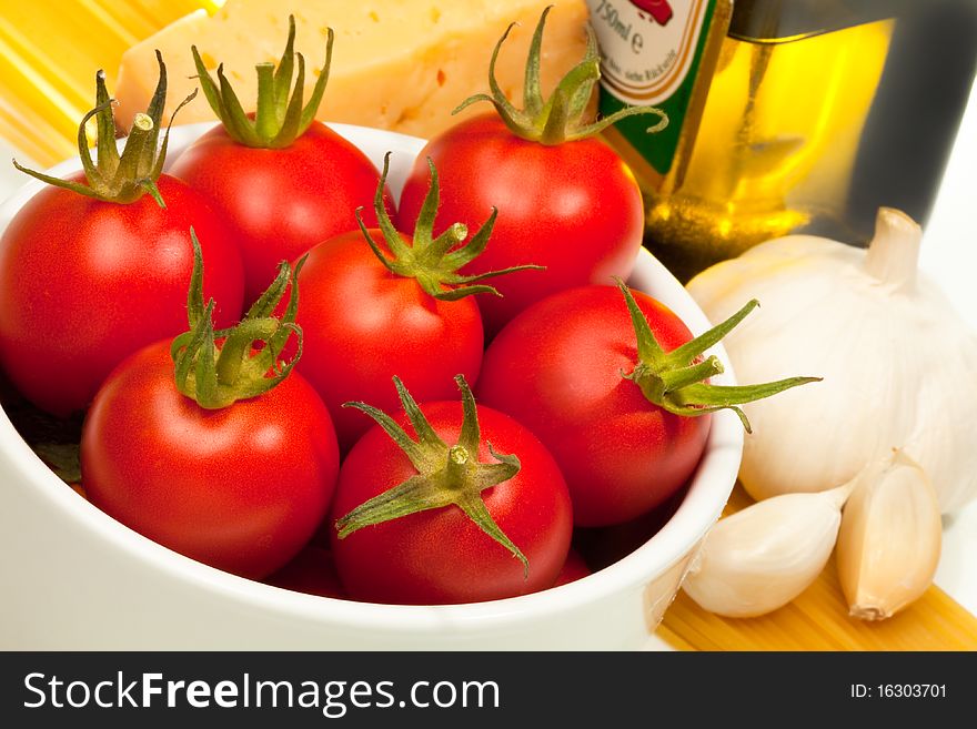 These are red tomatoes and spaghetti ingredients.