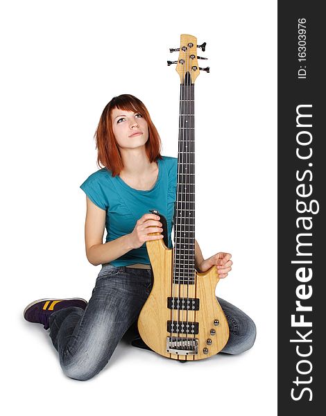 Redhead Girl Sitting And Holding Bass Guitar