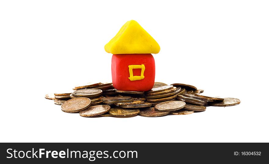 Photo of the plasticine house on coins. Photo of the plasticine house on coins