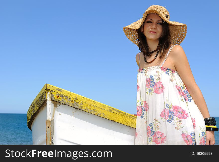 Young Woman And Rowboat.