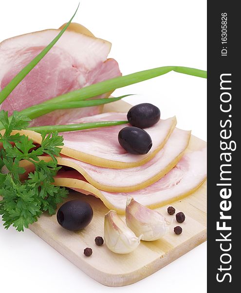 Nice fresh pink bacon with greens and spices isolated on white with clipping path