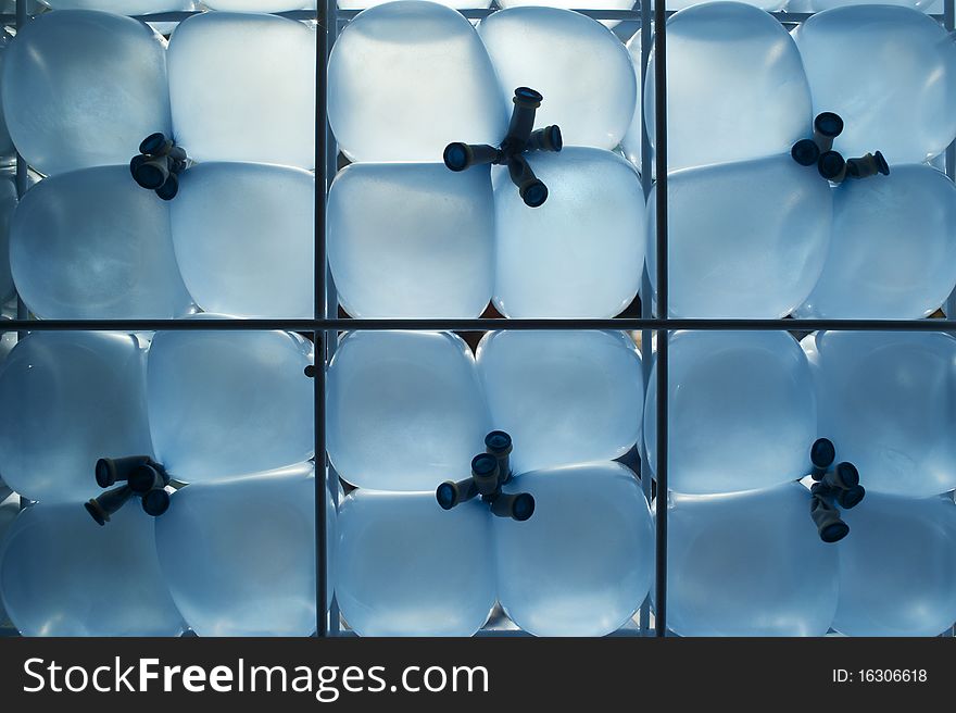 Blue balloons in a grid, placed in six squares like boxes, filling the whole frame. Blue balloons in a grid, placed in six squares like boxes, filling the whole frame