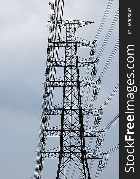 Electric high voltage post with sky background