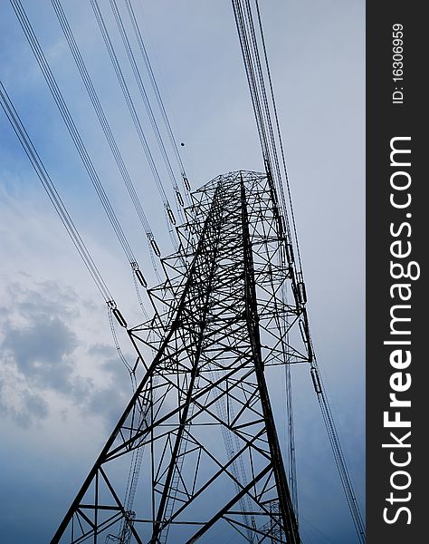 Electric high voltage post with sky background