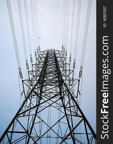 Electric high voltage post with sky background