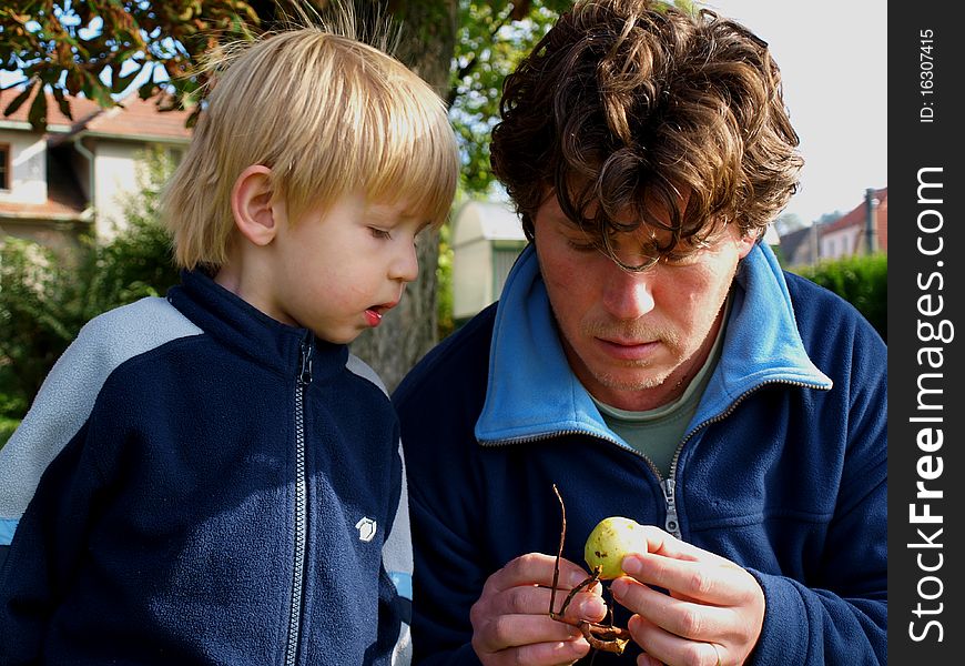 Father teaches son to know nature. Father teaches son to know nature