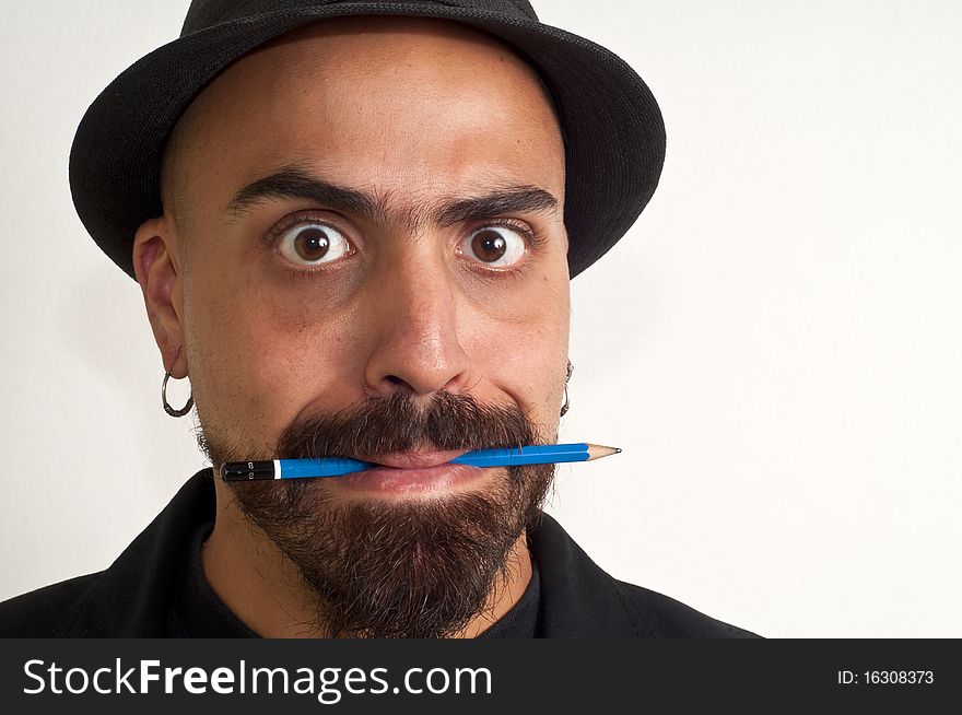 Man With A Pencil And A Hat With Funny Expression