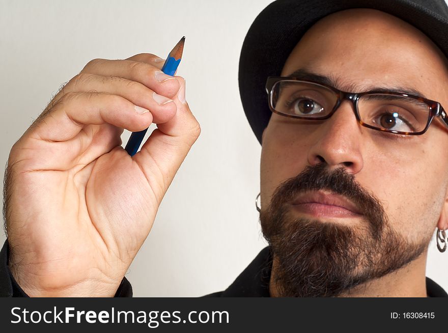 Man with glasses and a hat with a pencil in white background