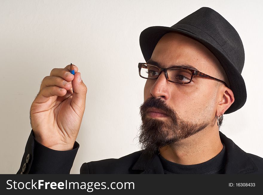 Man With Glasses And A Hat With A Pencil