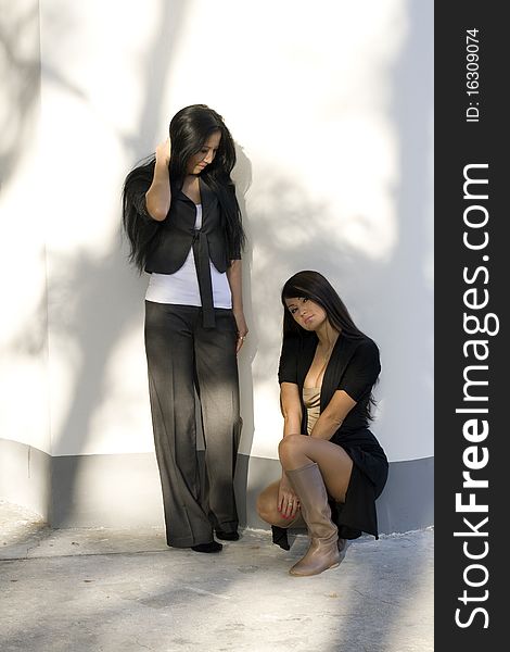 Two female friends walking outdoor