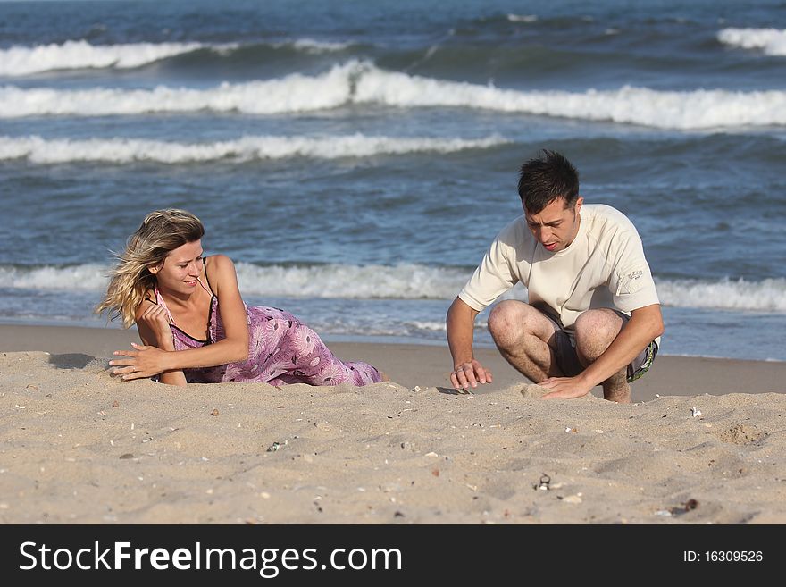 Couple on the sand near the sea